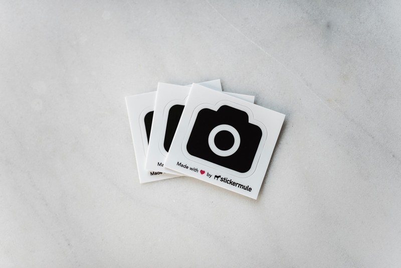 stickermule stickers for unsplash on a marble table, unsplash stickers by stickermule 4k