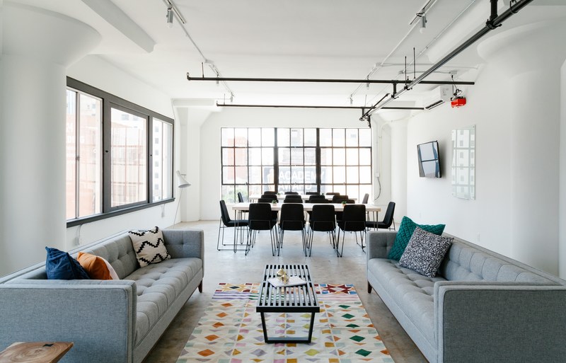 a workspace with two long sofas and two meeting tables, 120 e 8th street los angeles california 4k