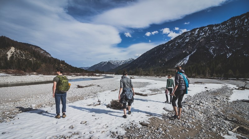 a group of four hiking through a rocky valley in the mountains of lenggries bayern deutschland, warm hike through rocky valley 4k