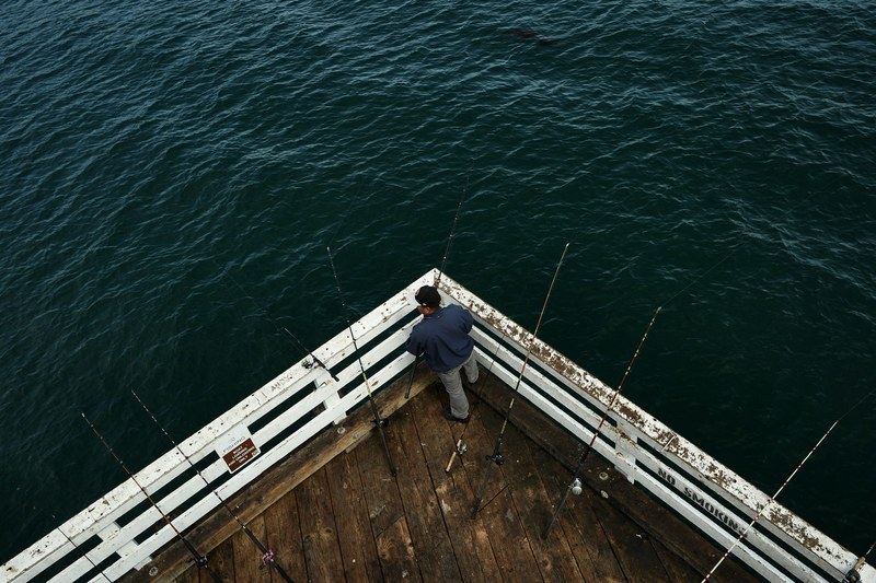 pier fishing dock and fishing rod 4k