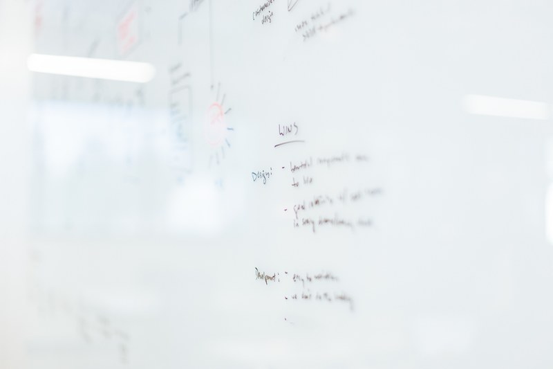 bullet points listed on a glossy whiteboard, business plan on a whiteboard 4k