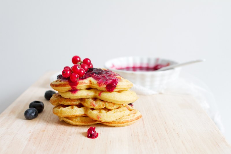 red currants blueberries and marmalade on a stack of heart shaped waffles, berries on heart waffles 4k