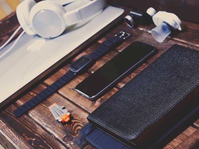 a flatlay with a watch an iphone a macbook and a laptop, what you carry 4k