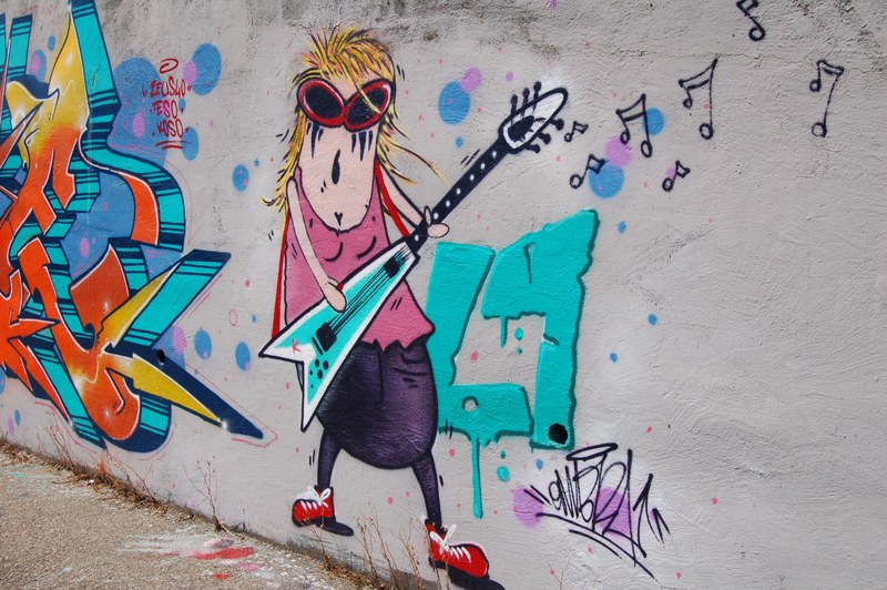 a wall painting of a fat woman wearing rockstar glasses playing an electric guitar, _fat woman playing guitar 4k