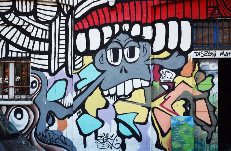 a weird grey character graffiti painted on a building wall, _grey graffiti character 4k
