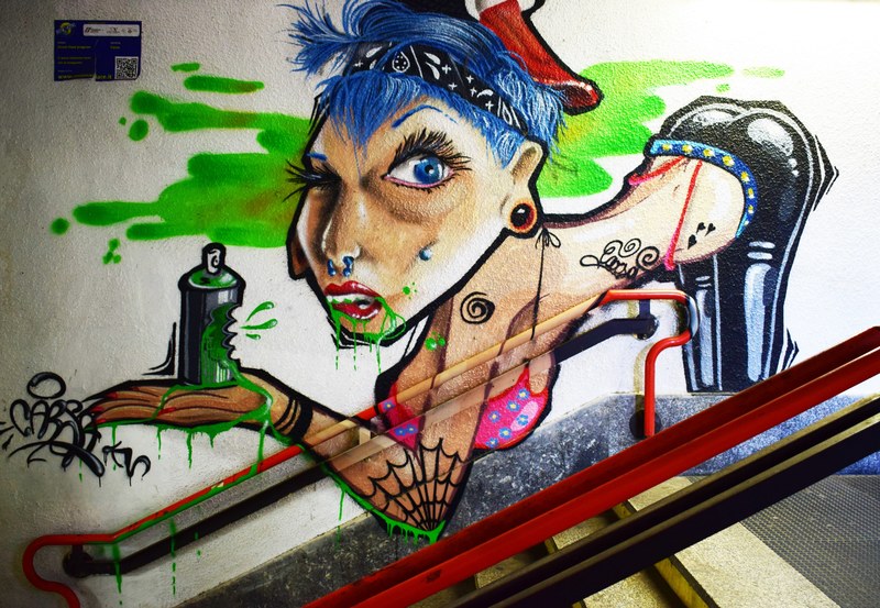 a trashy woman bent over holding a can of green spray paint, _trashy woman graffiti 4k