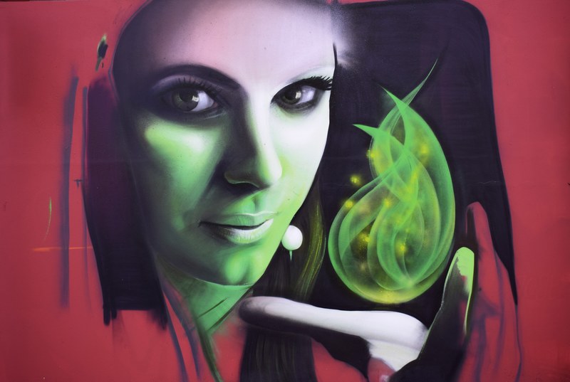 graffiti of a woman levitating a mystical item above her hand, _spectacular street art 4k