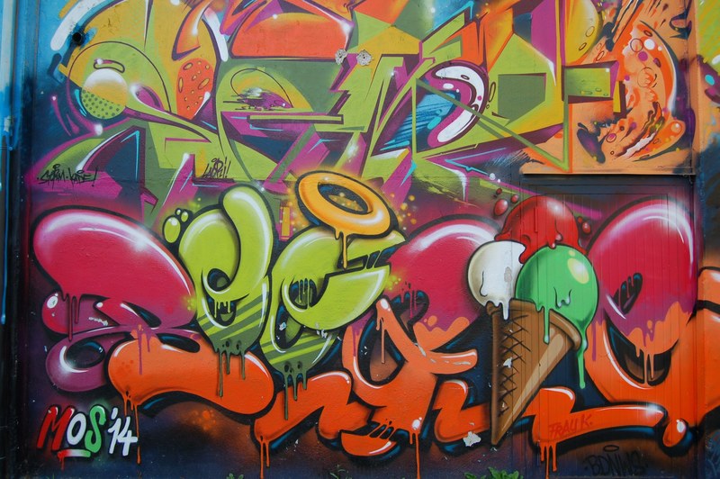 graffiti writing on a wall with a clock and dynamite, _colorful graffiti text 4k