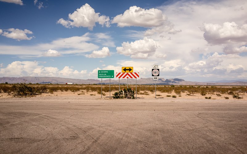road signs show the way at a dead end on a desert road, show me the way 4k