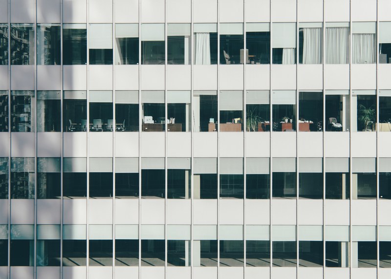 offices and conference rooms seen through the windows of an office building, office space seen from outside 4k