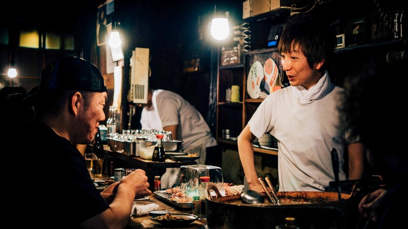 waiter and patron talk over a meal at a restaurant in japan, night shift at the restaurant 4k