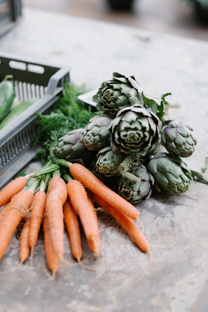artichoke carrots and fresh produce at the market ready to eat, visiting a local french market 4k
