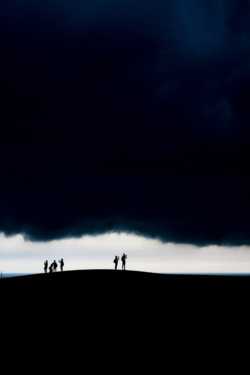 people standing under dark clouds, _dark clouds 4k