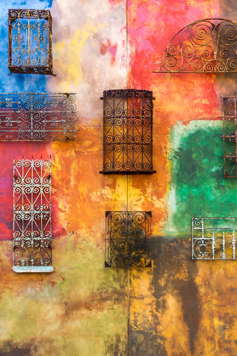 gate structures hanging on a colorful wall, _metal gates on colored wall 4k