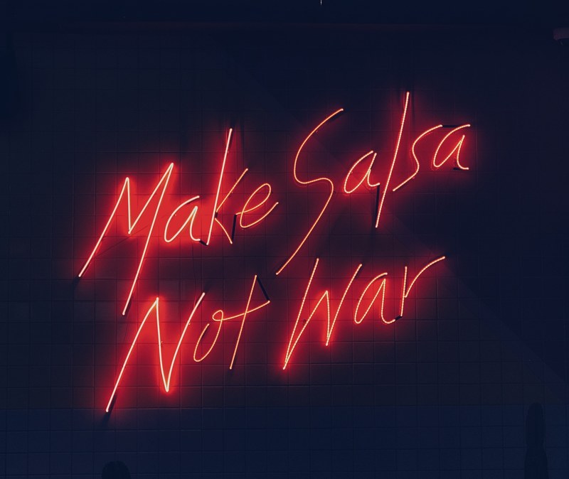 a neon sign that says make salsa not war, make salsa not war 4k