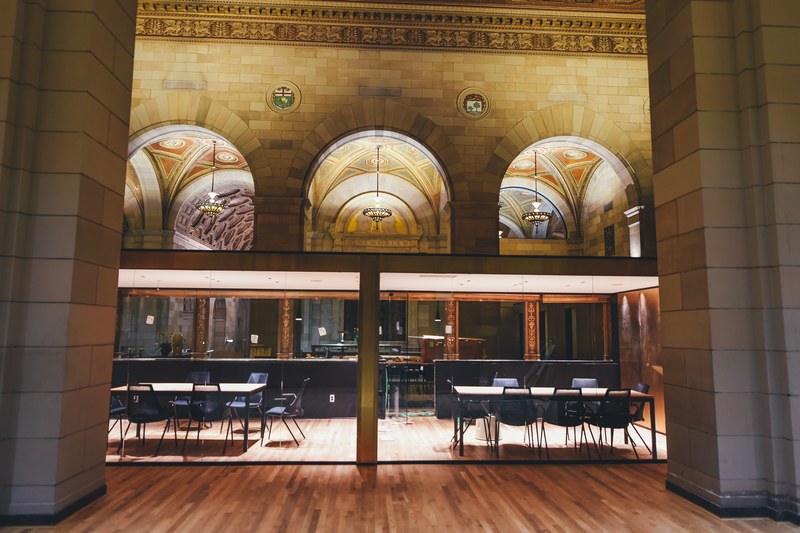 two tables in a conference room behind a glass wall in a cathedral like building, conference room behind glass 4k