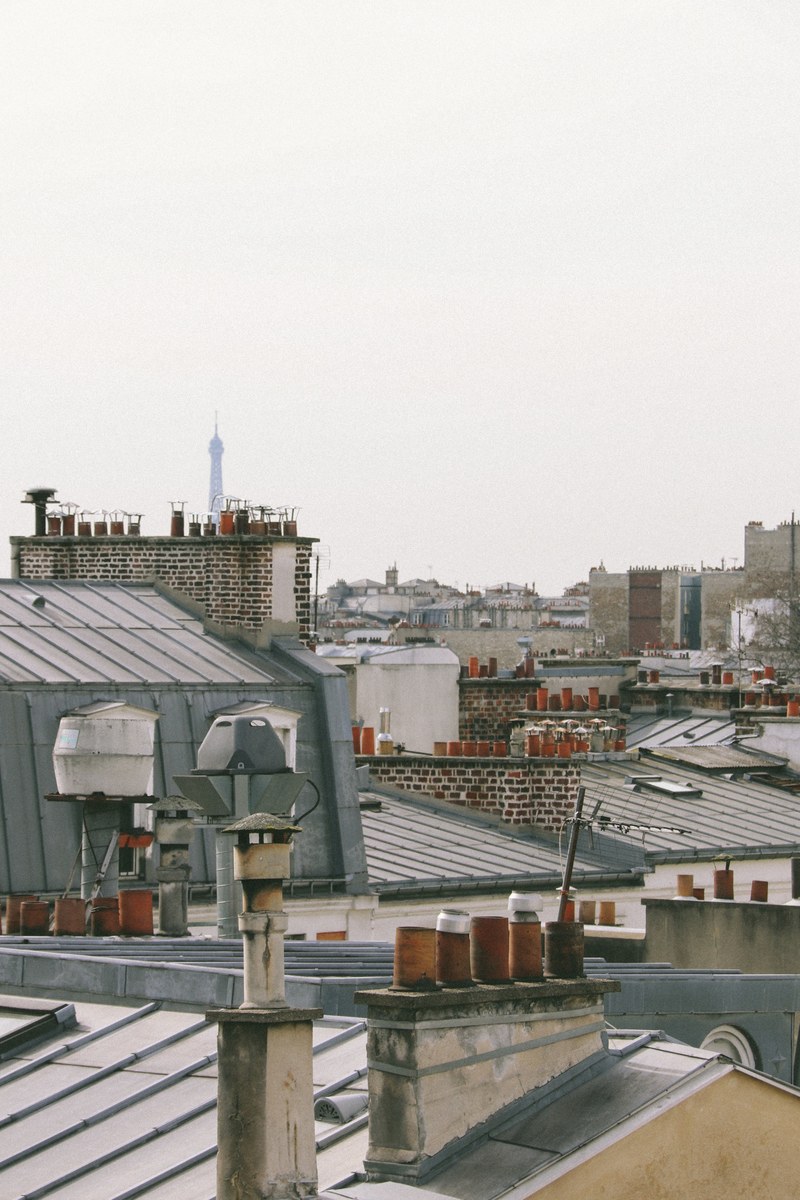 view of rooftops in paris with brown chimneys, paris rooftops with chimneys 4k