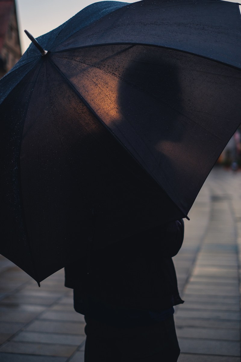 a person walking outside with an umbrella, _sunshine after rain 4k