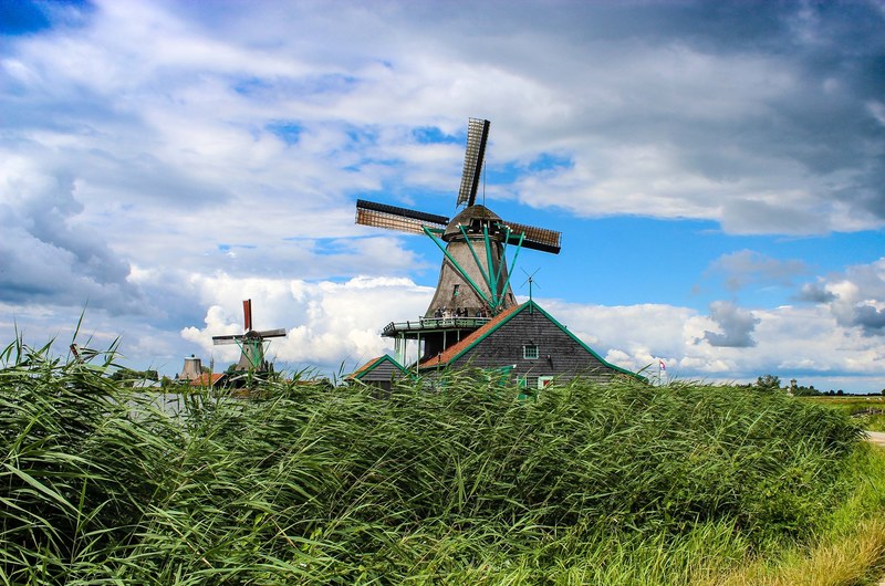windmill grass field and building 4k