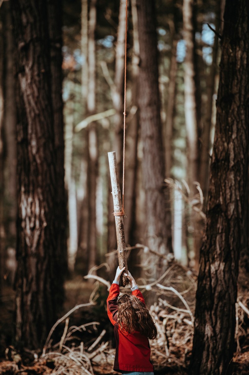 child playing with rope swing 4k