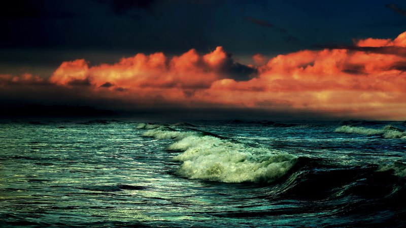a dramatic shot of dark crashing waves under a red cloudy sky, dark waves under red clouds 4k