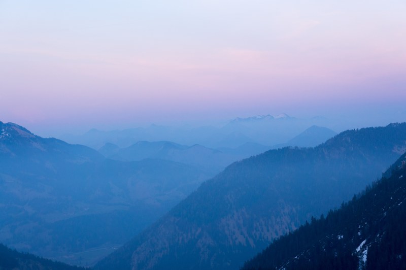 a misty mountainous landscape under a pastel colored sky, pastel sky over mountains 4k