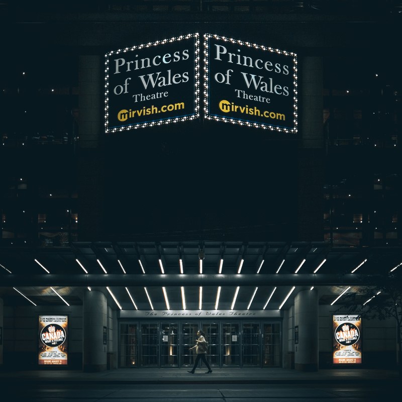 front of princess of wales theatre at night with glowing sign and lights, princess of wales theatre 4k