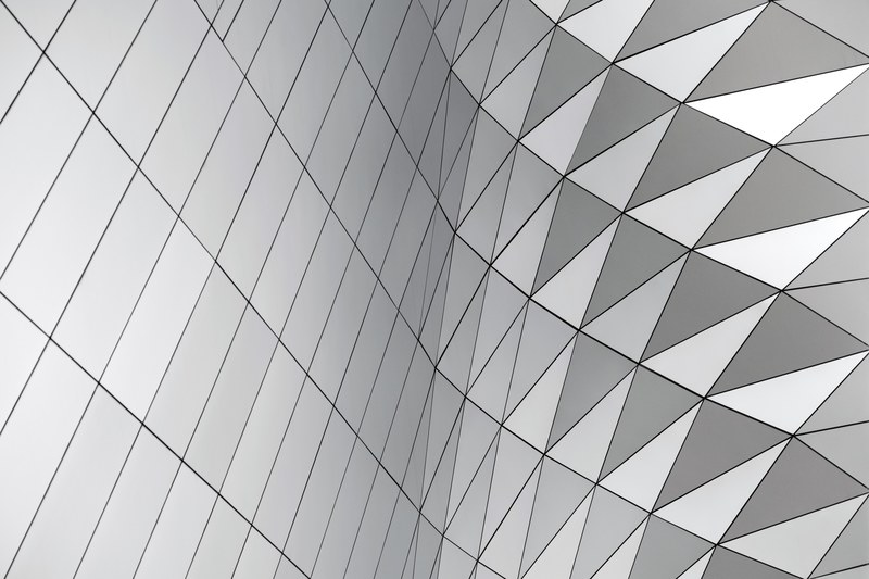 a pattern with squares and triangles in a curving gray facade, abstract geometric facade 4k