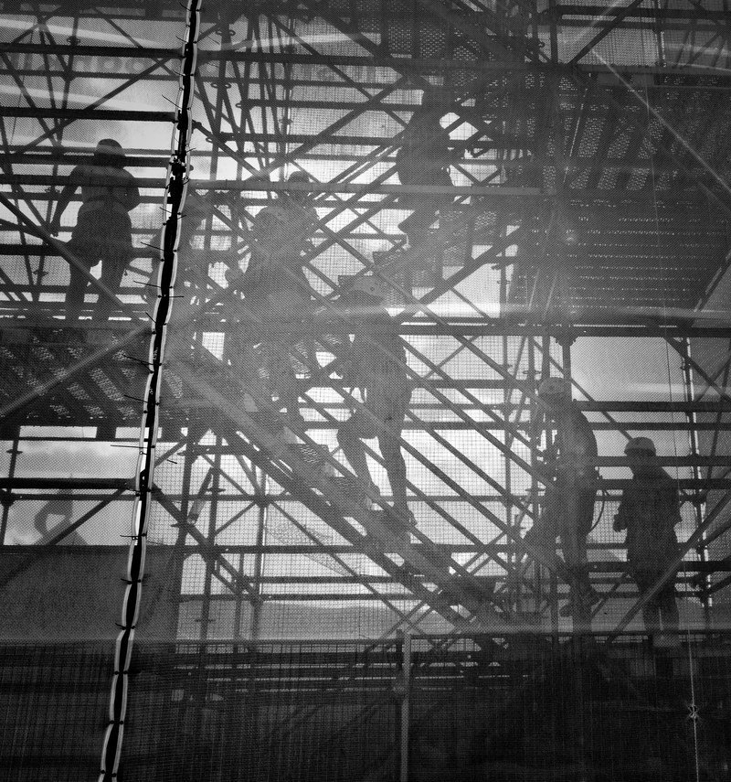 construction workers walk up scaffolding to their site, construction work 4k