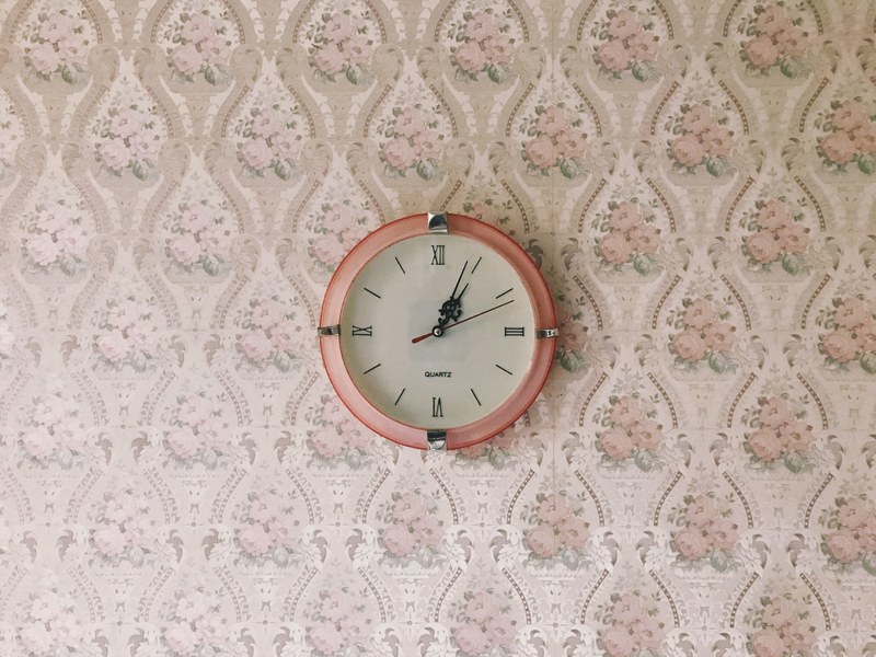 a pink clock on a pink floral patterned wall in williamson, clock on a floral 4k