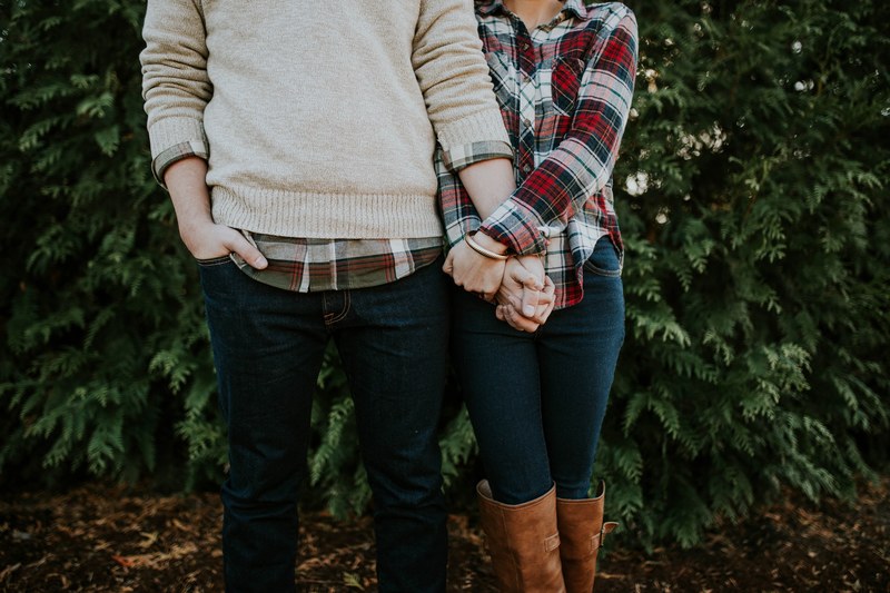 couple in plaid jeans and sweater holding hands at botanical garden of the ozarks, plaid together 4k