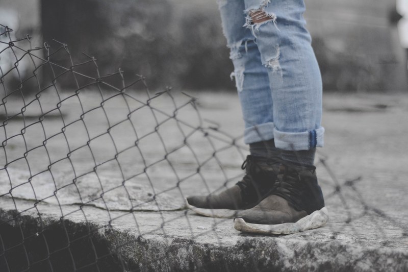 person jeans ripped and shoes 4k