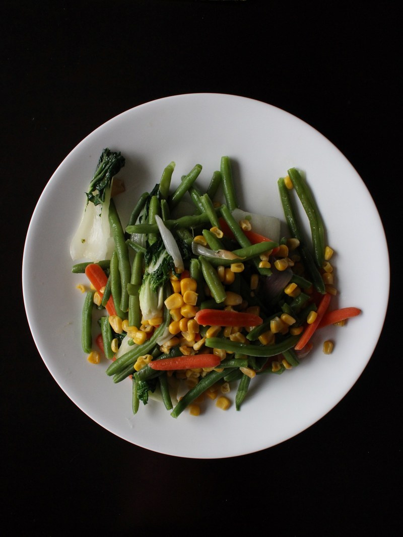 a white plate full of green beans corn carrots and bok choy, plate of vegetables 4k