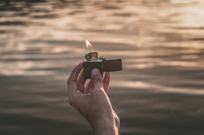 lighter fire flame and hand 4k