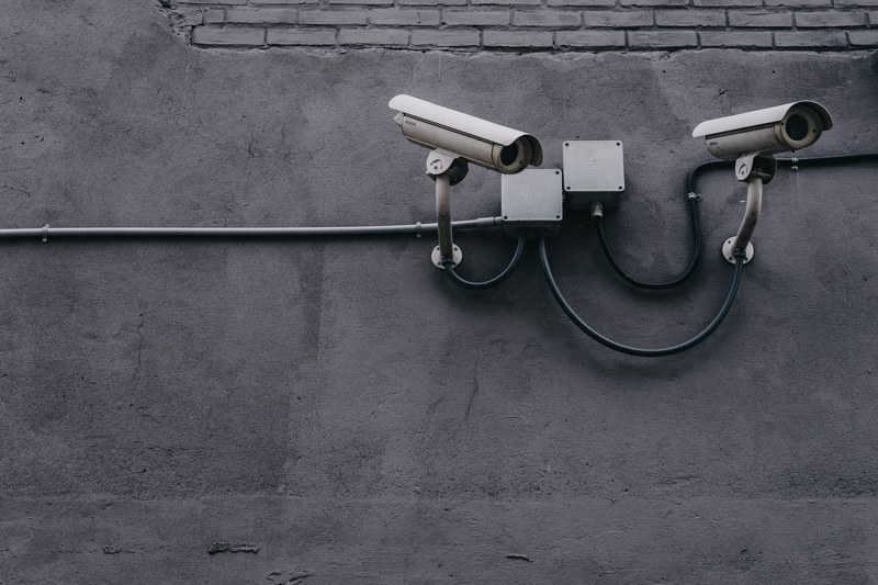 two cctv cameras on a gray wall, 404 4k