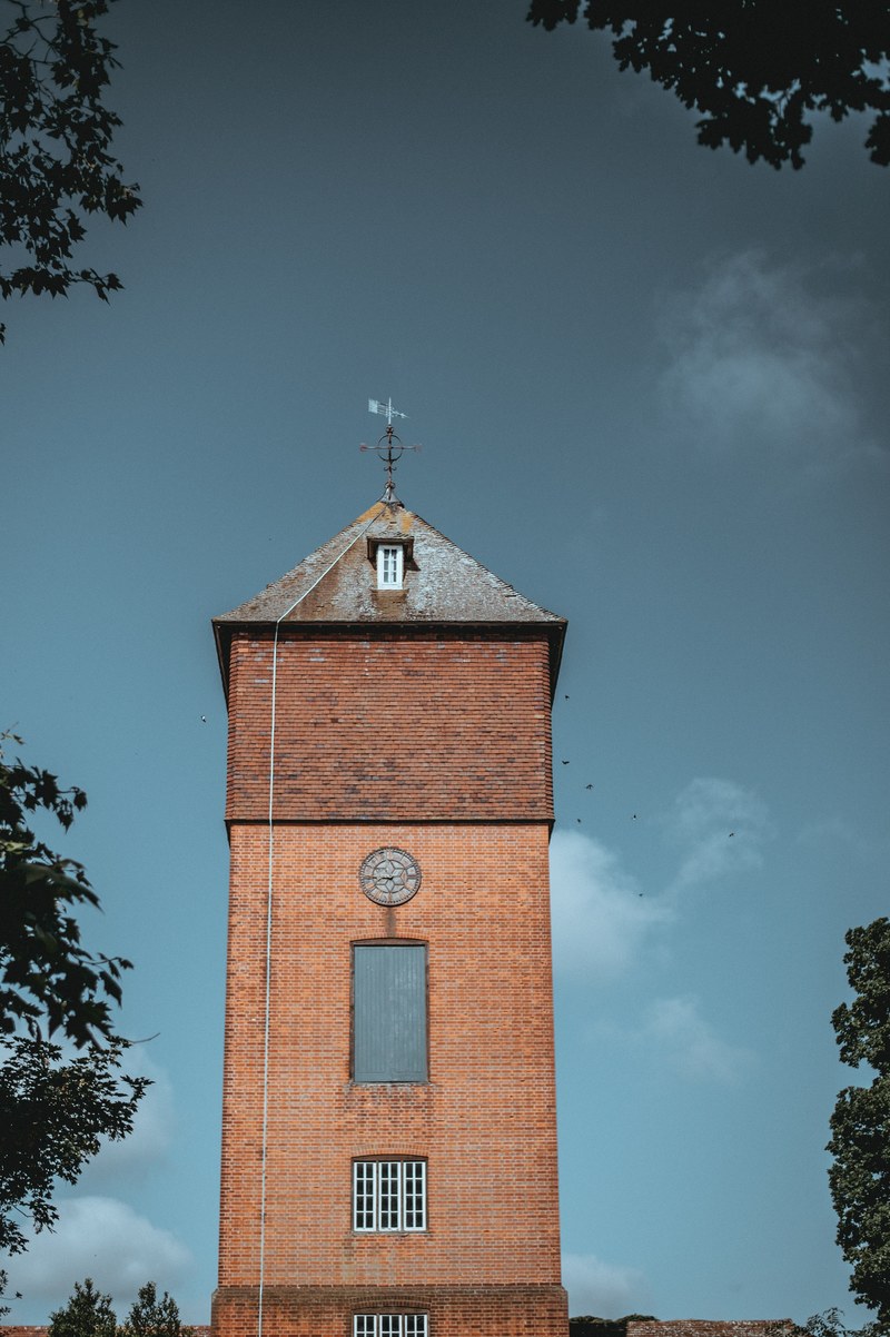 house martins flying around exbury water tower 4k