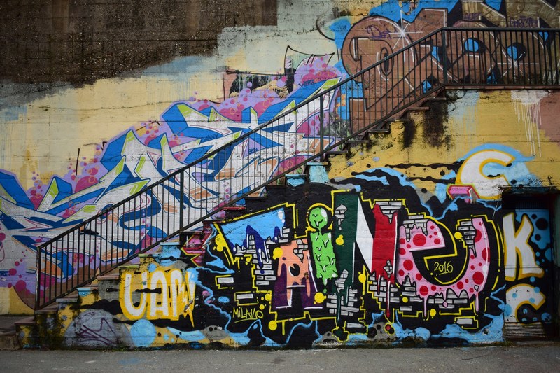 urban stairs and railing with colorful grunge graffiti covered walls, the wall 4k