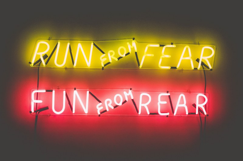 a yellow neon quotrun from fearquot sign above a red neon quotfun from rear sign, _kinky 4k