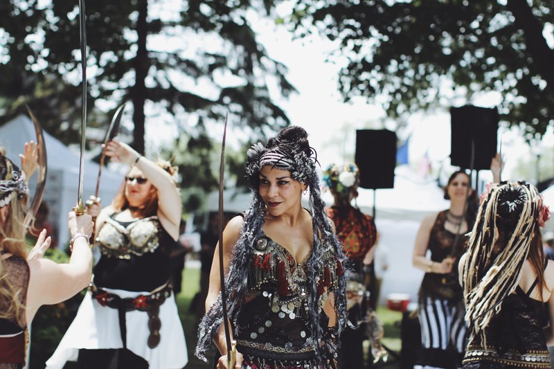 woman dressed like vikings and pirates at a renaissance faire, ren faire costumes 4k