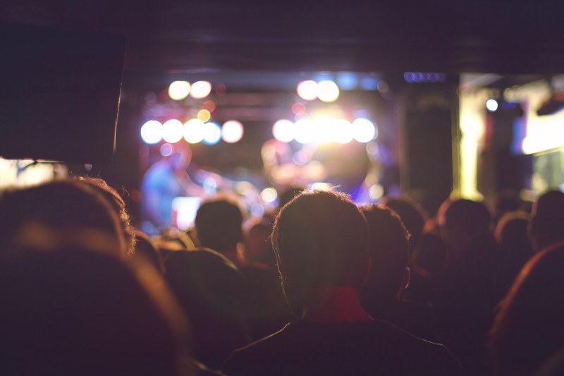 view from a crowd in a concert showing light on the stage in caf la palma, concert tuya 4k
