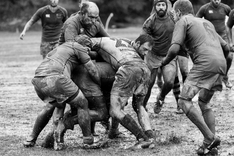 rugby players tackle each other during a muddy game, rugby 4k