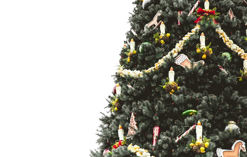 a festive nicely decorated christmas tree stands against a white background, festive christmas tree 4k
