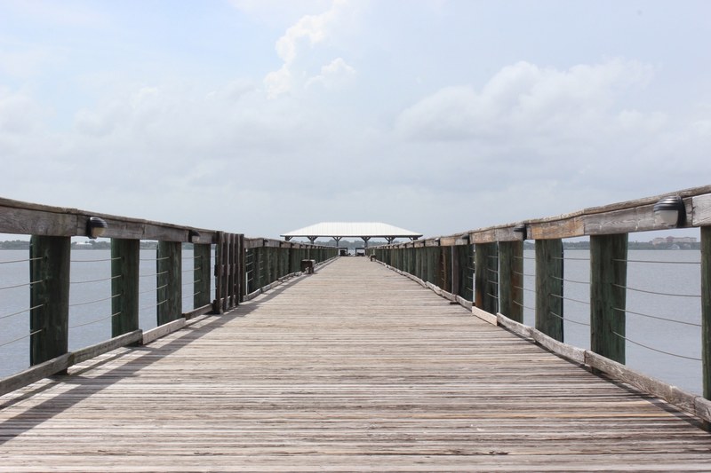 view of the wooden pier walkway with a pavilion at the melbourne beach, wooden pier walkway 4k