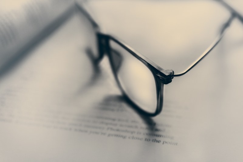 a pair of glasses on an open book, reading glasses 4k