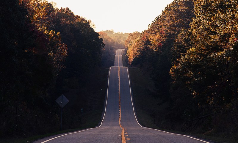 highway 212 with multiple high slope hills and complete tree coverage on both sides of the road, highway 212 forest road 4k