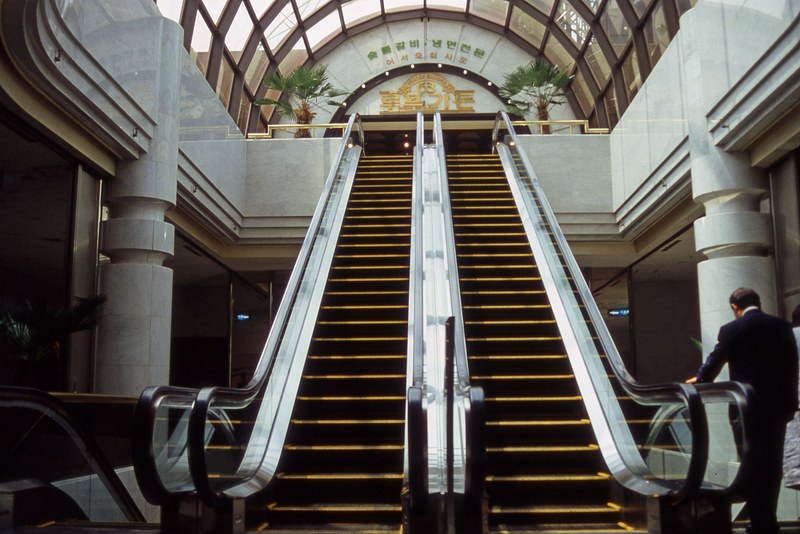 escalators inside the 63 building 4k