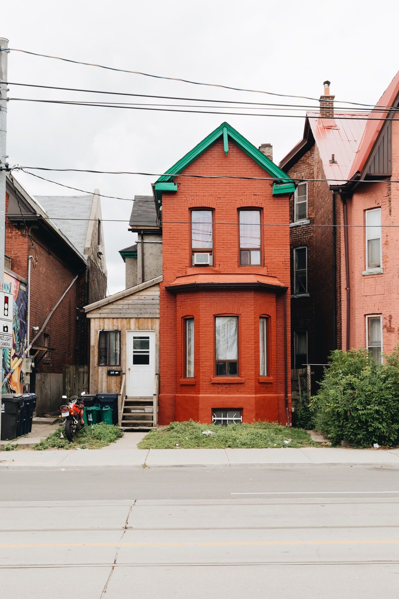 narrow red house with green roof in toronto residential neighborhood, narrow red house green roof 4k