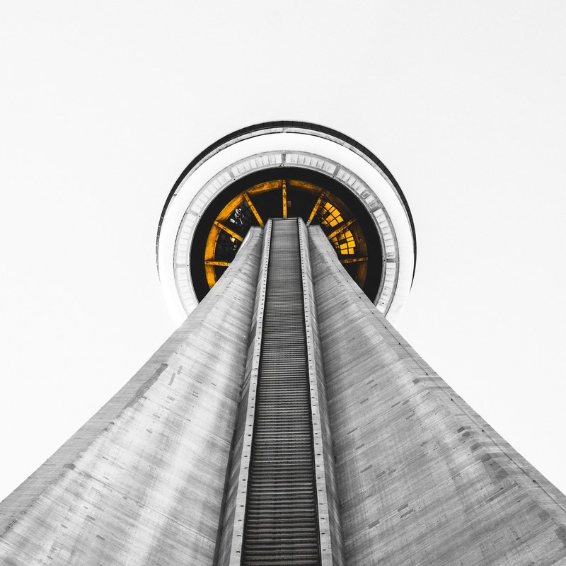 a low angle shot of the tall cn tower in toronto, subjacent 4k