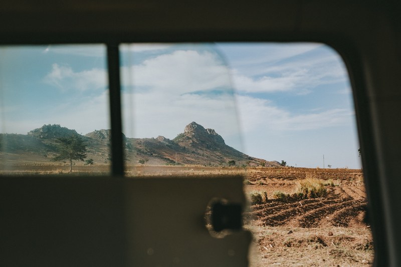 desert and mountain seen through car window on a road trip, desert view through car window 4k