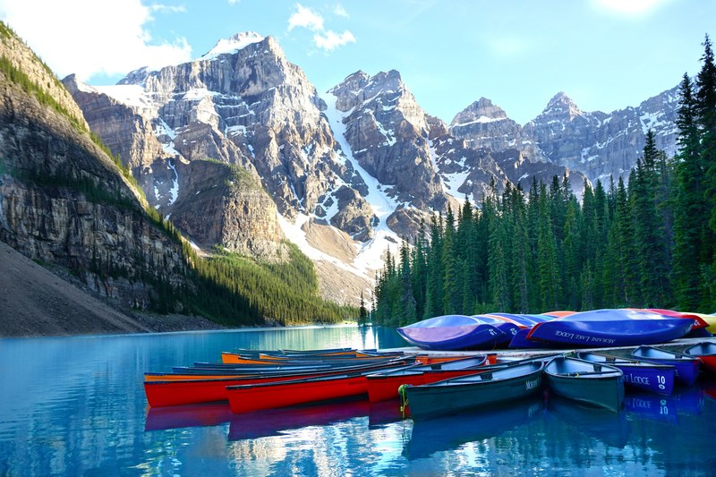 mountain ridge mountain range water and canoe 4k